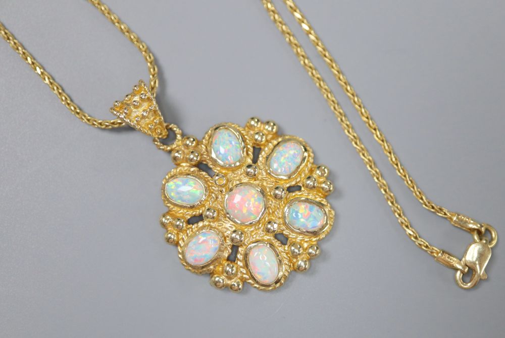 A Turkish 585 and white opal flowerhead pendant on chain by Istor, 13.4g